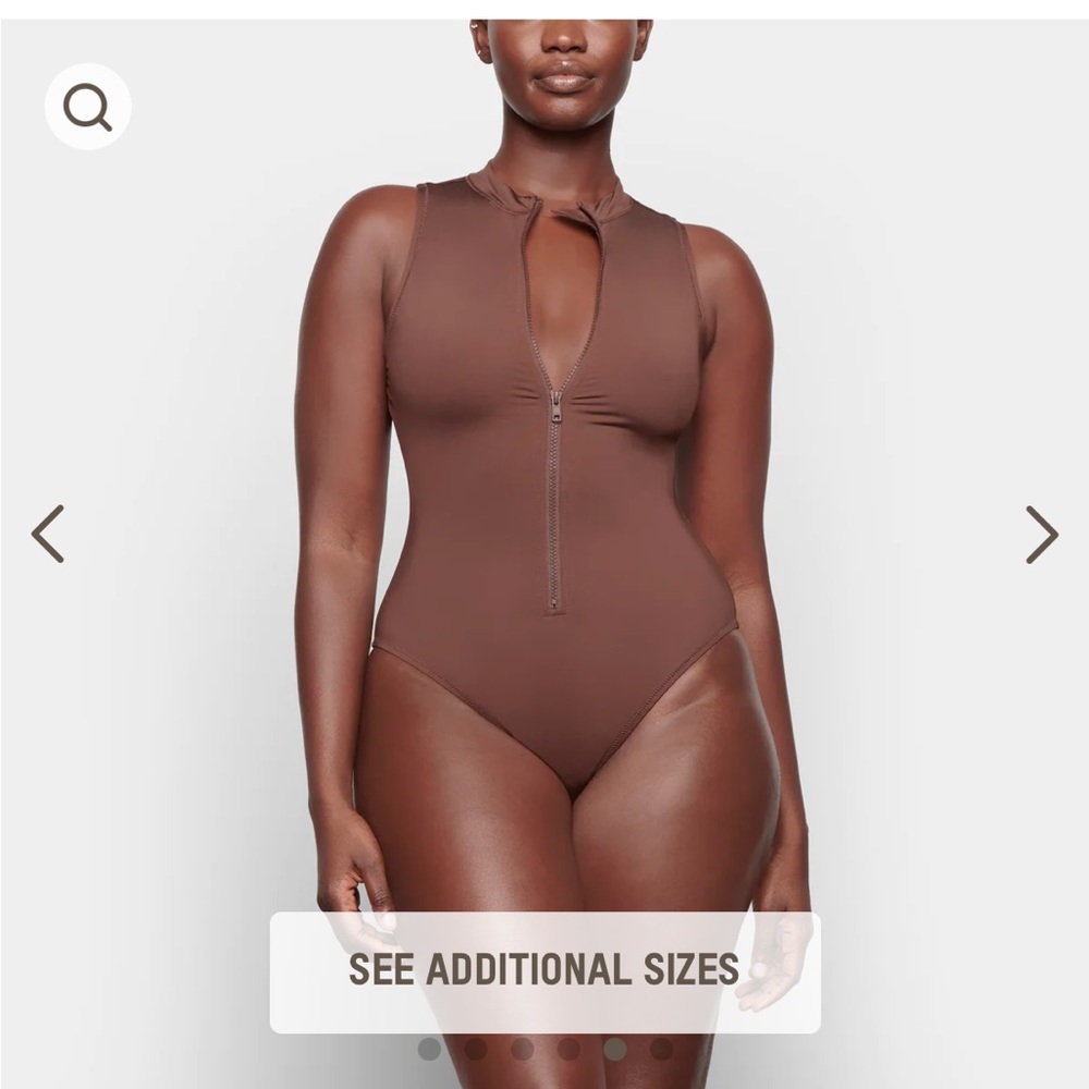 Skims zip front sleeveless swim suit
